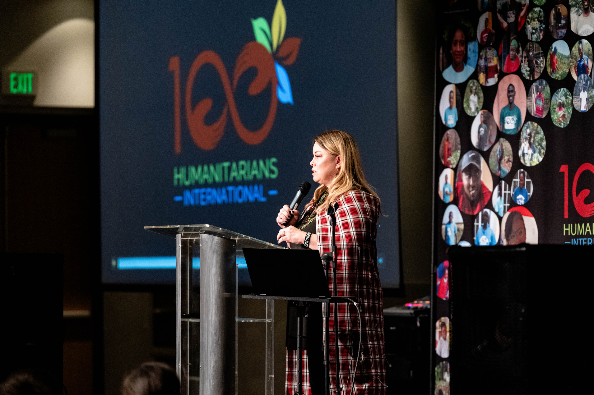 Heidi Totten speaking on stage at a 100 Humanitarians gala