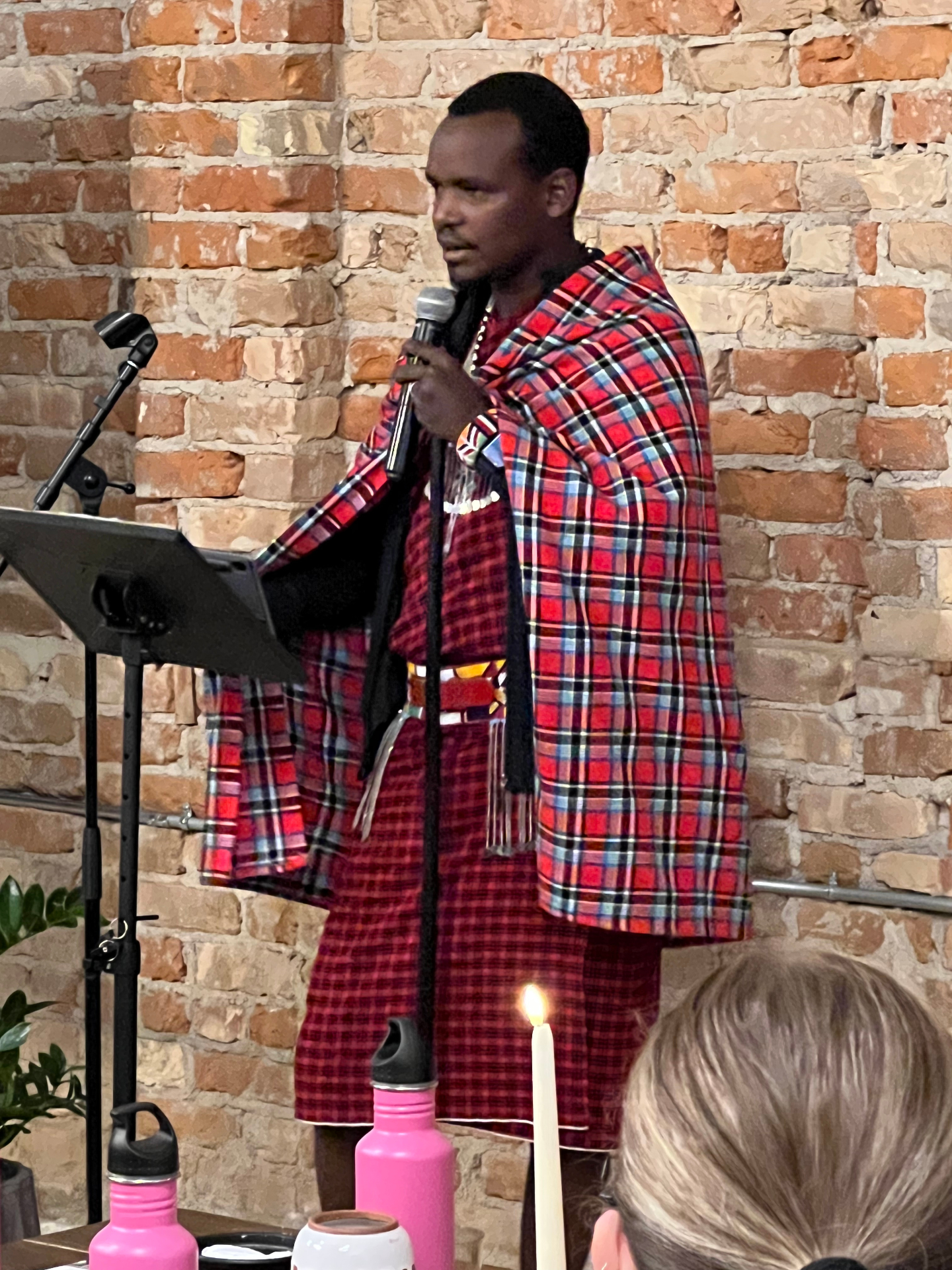 Moses Masoi speaking at a podium