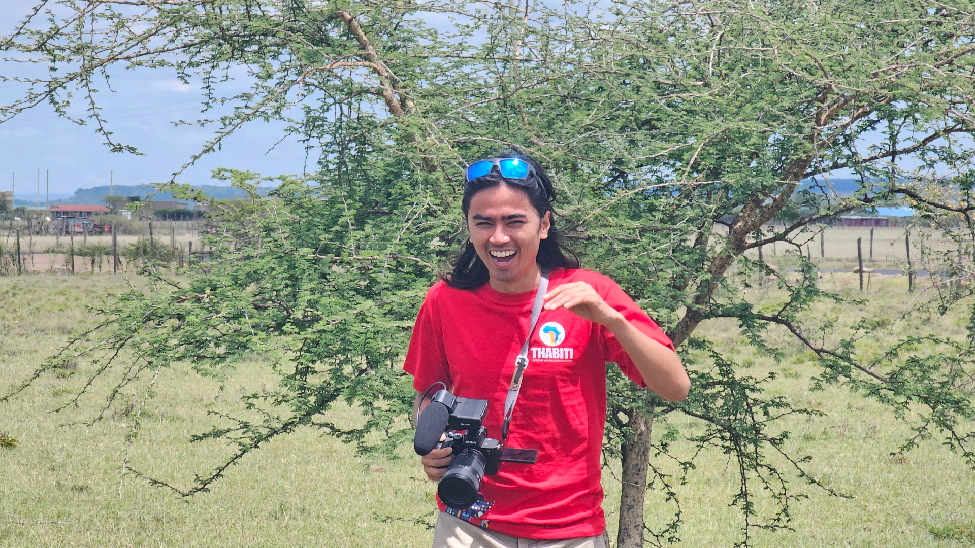 Chris Dabao with camera in Kenya