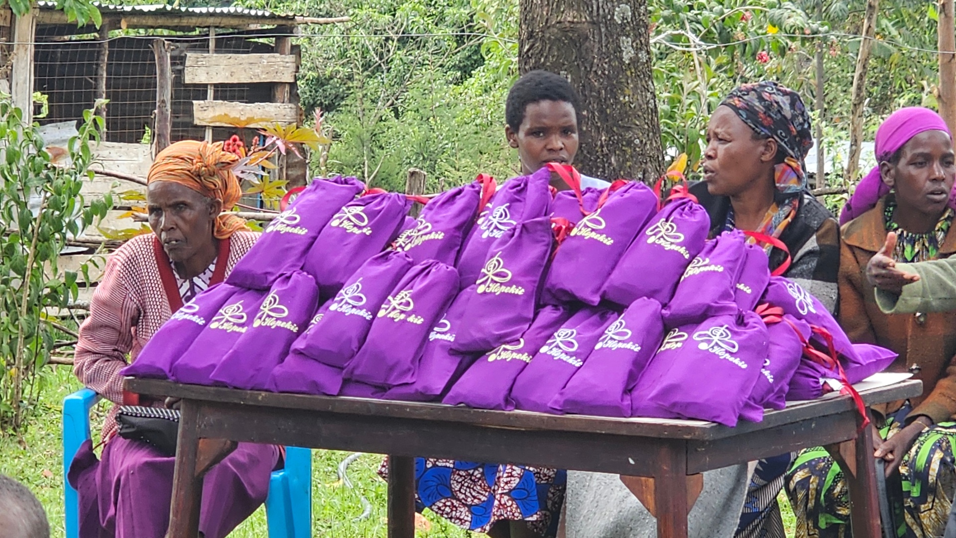 A girl receiving health education with her new HopeKit in rural Kenya