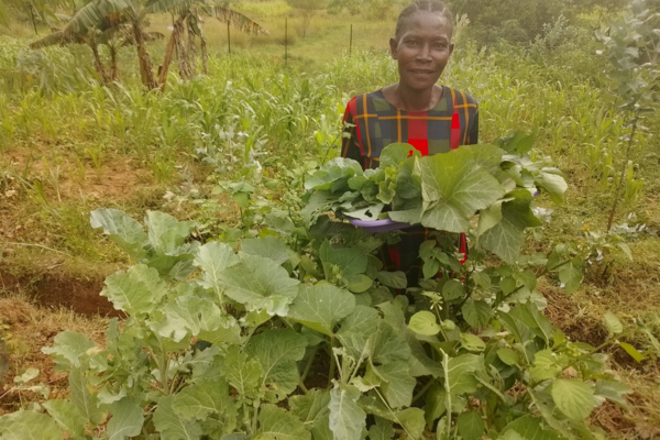 Mary with her Garden Tower vegetables in Kenya